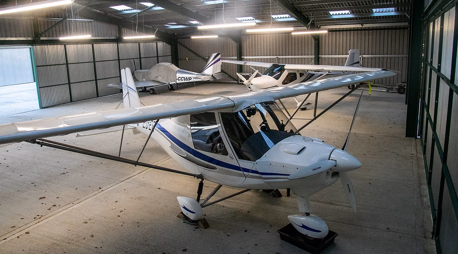 Light aircraft inside a hangar at Deanland Airfield