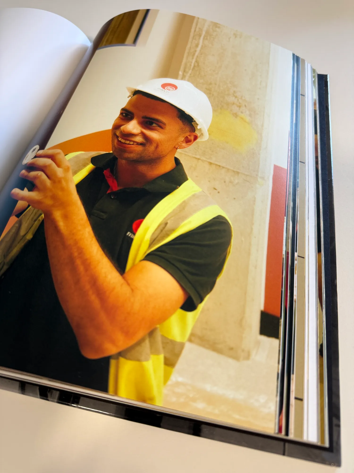 M-Tech engineer in a hard hat and hi-vis on a construction site