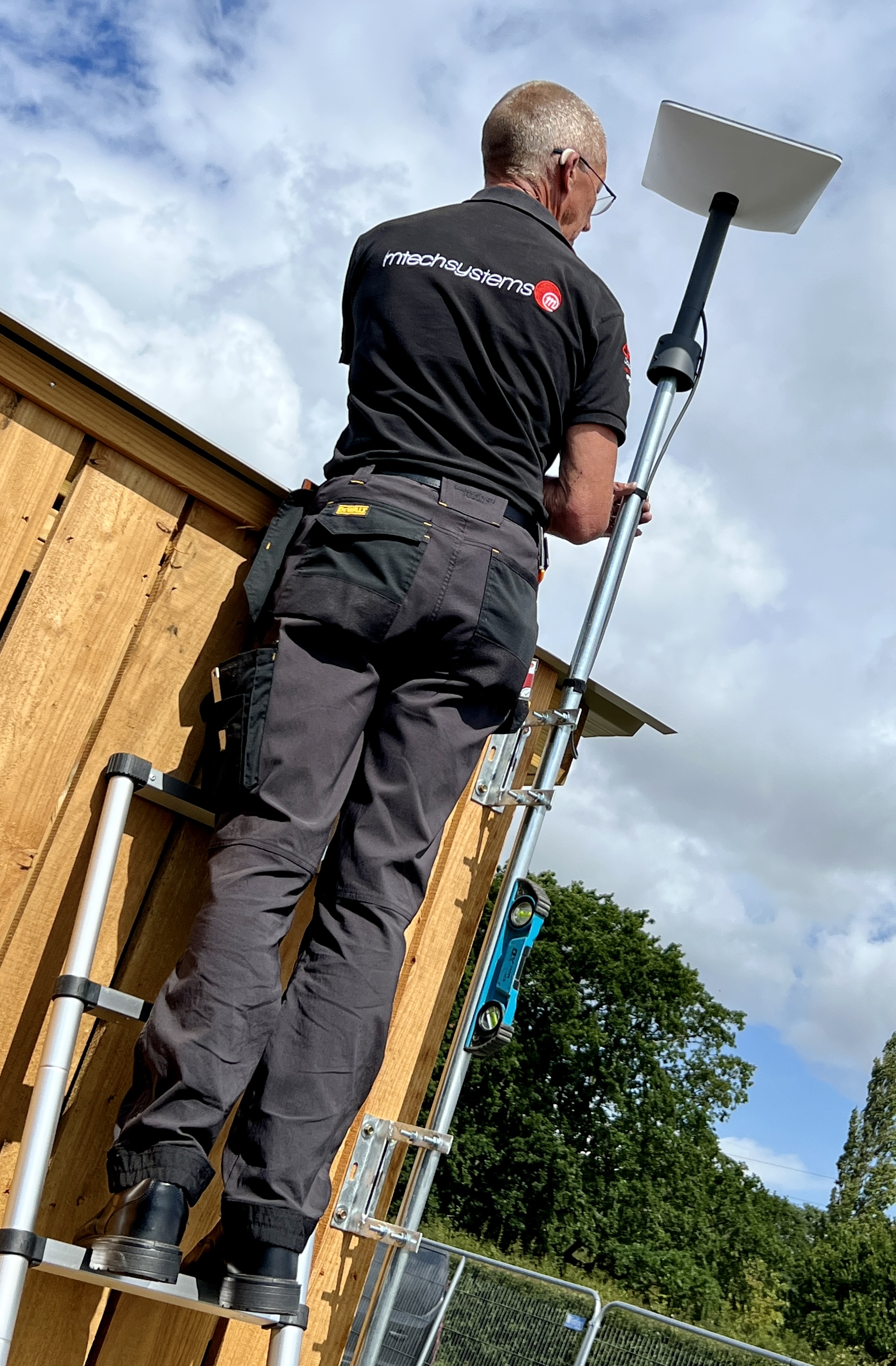 M-Tech engineer installing a Wi-Fi access point at Chiddfest