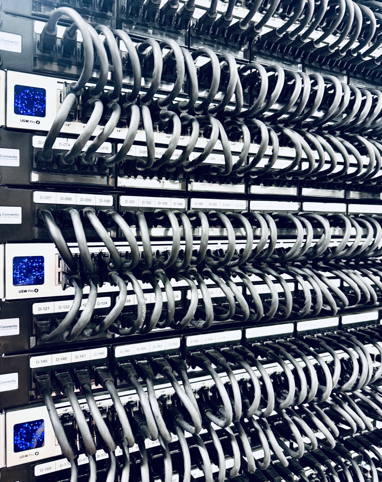 Patch panel and Ubiquiti switch stack inside a FOUNDRY comms cabinet
